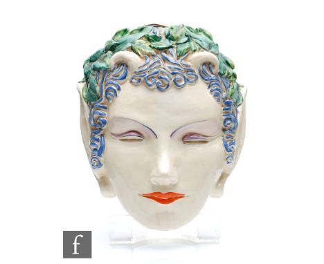 Clarice Cliff - Pan - A facemask circa 1934, relief molded as an impish face with horns and floral hair, picked out in enamel