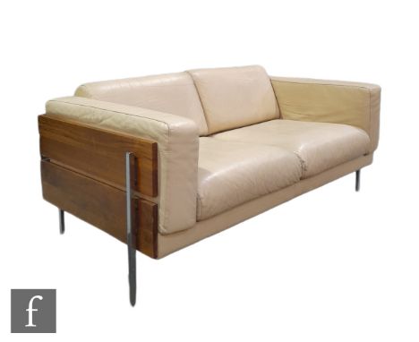 Robin Day - Habitat - A Forum two seat sofa, upholstered in cream coloured leather, the frame with dovetailed walnut panel si