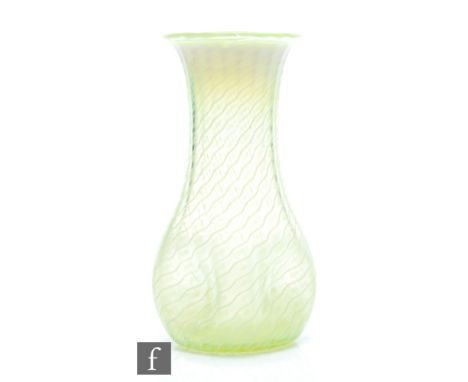 In the manner of James Powell &amp; Sons - An early 20th Century straw opal glass vase with quatrelobed dimple knocked sides 