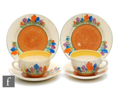 Clarice Cliff - Crocus - A globe shape tea cup, saucer and side plate circa 1930, hand painted with radial Crocus sprays with