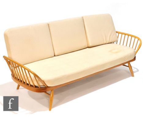 Lucian Ercolani for Ercol Furniture - A model 355 studio couch or sofa, with solid elm panel back above a beech spindle frame