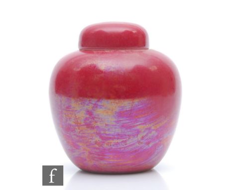 Ruskin Pottery - A small jar and cover or caddy decorated in a Strawberry Crush pink lustre, impressed mark and dated 1921, h