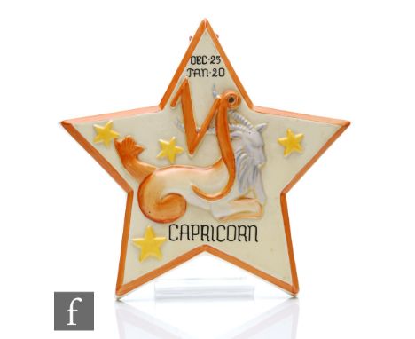 Clarice Cliff - Zodiac - A wall plaque circa 1936 for Capricorn, relief moulded with the sign of the zodiac picked out in ena