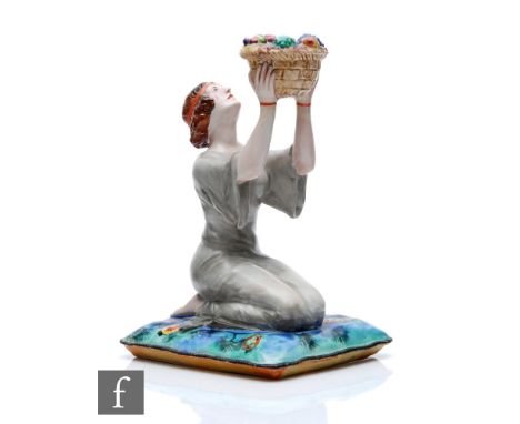 Clarice Cliff - A.J.Wilkinson - A figural candlestick modelled as a kneeling lady in flowing gown holding aloft a basket of f