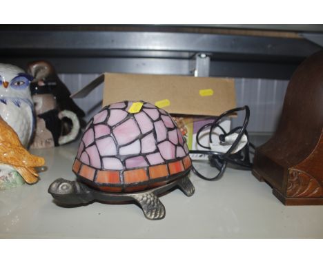 A stained glassed table lamp in the form of a tortoise