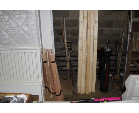A bundle of long handled gardening tools 