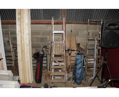 An aluminium step ladder together with a wooden step ladder