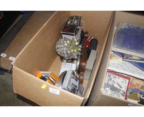 A box containing a barometer, clock, binoculars etc.