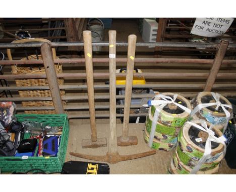 Two sledge hammers and pick axe