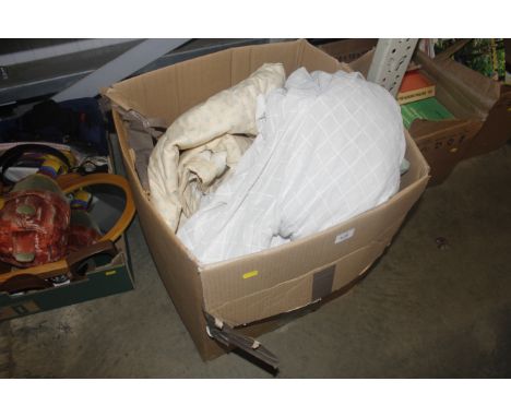 A box of miscellaneous curtains and textiles