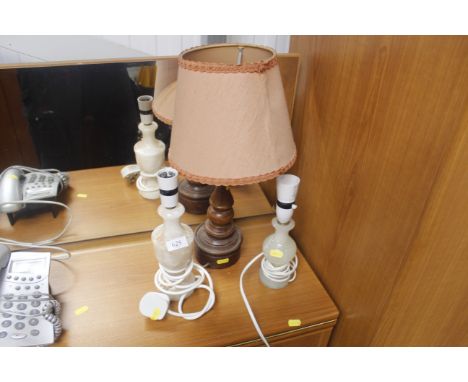 A turned oak table lamp and two Alabasta table lamps