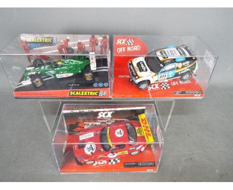 Scalextric - SCX - 3 x boxed slot cars, # 6115 Jaguar F1 car, # 62770 VW Toureg, # A10105 Mercedes SLS GT3. All the cars appe