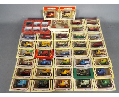 Lledo, Ertl - A collection of over 40 boxed diecast model vehicles from Lledo with a boxed Ertl #1739 International Harvester