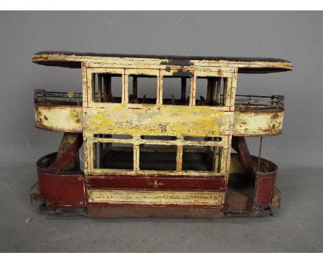 A scratch built wooden model of a double deck Liverpool Corporation Tramcar. The model which measures approximately 40cms in 