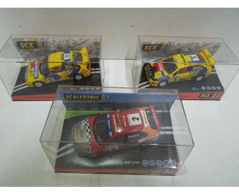 Scalextric - SCX - 3 x SEAT WRC slot cars, # 6133 Leon, # 60220 Cordoba, # 60230 Cordoba. All cars appear Mint in Near Mint p