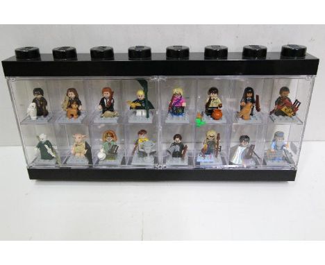 LEGO - A black plastic Lego display case in black containing 16 Lego 'Harry Potter' minifigures. Minifigures include Professo