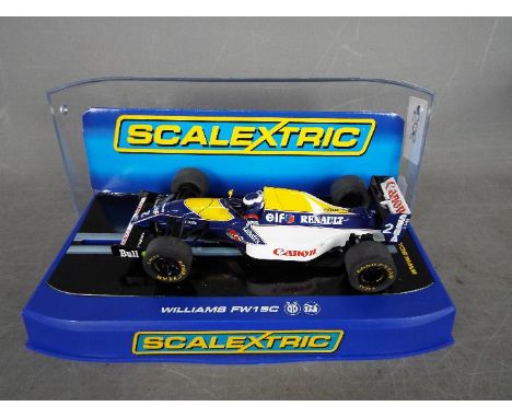 Scalextric - Williams FW15C Alain Prost 1993 car. The model appears Mint in a Near Mint perspex display case with only very l