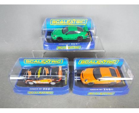 Scalextric - 3 x Porsche 997 slot cars, # C2871 GT3 RS in orange, # C3074 GT3 RS in green, # C3132 GT3 RS in Mad Butcher live