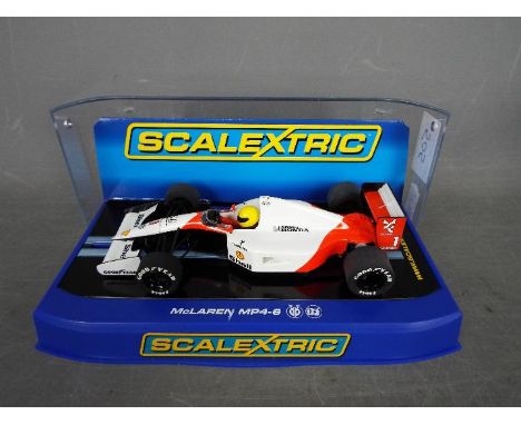 Scalextric - McLaren MP4-6 Ayrton Senna 1991 car # C3095. The car appears Mint in a Near Mint perspex display box with minor 