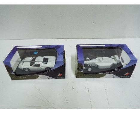 Scalextric - 2 x limited edition Club Ascari cars in plain white finish. The Ford GT shows some signs of use and has a scratc