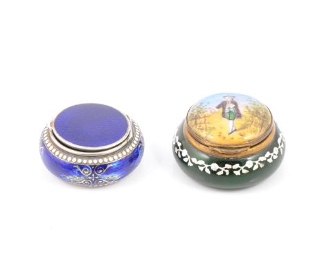 A Bilston style circular patch box, green base with a white floral garland, brass hinged lid decorated with a young man in 18