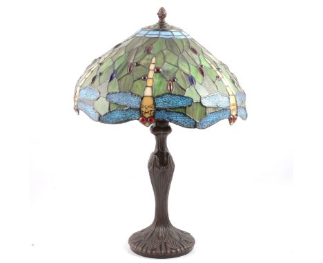 Reproduction Tiffany style table lamp, late 20th century, the leaded glass shade with dragonfly, brown patinated metal base, 