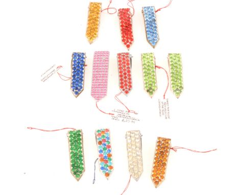 Twelve 1930's dress clips in electric coloured paste, pink. lime green, red, blue, multi-colour, all arrow design, 45-50mm.