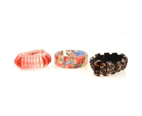 An Art Deco style red coated lucite expanding bracelet, 1940's/50's, triangular sections, 35mm wide, another expanding bracel