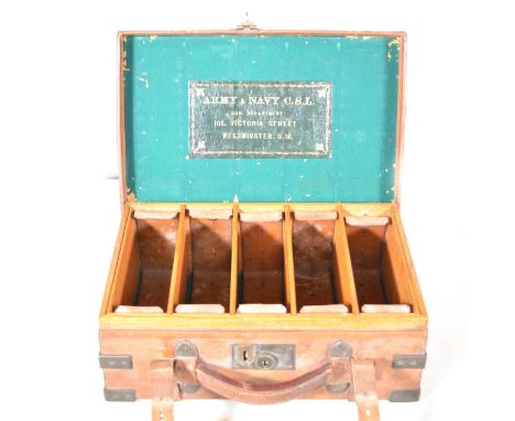 An oak lined leather and brass mounted cartridge case, Army &amp; Navy CSL, brass plaque with engraved initials H.E.N., width