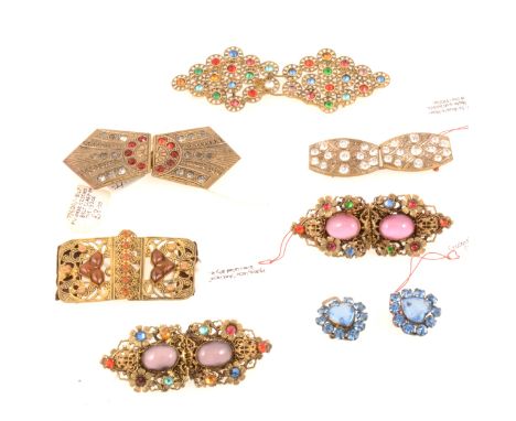 Five 1930's Czechoslovakian paste set buckles, white and yellow metal, 95mm buckle with multi-coloured gems, 60mm buckle with