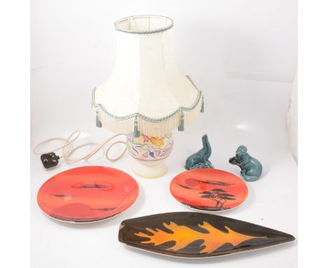 A Poole pottery lamp, floral pattern, 24cm; a set of four hors d'oeuvres dishes; a large African Sky pattern plate, 28.5cm; a