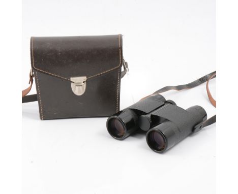 A pair of Leitz Trinovid binoculars, 8x30, Serial No. Germany 63807, branded leather carry case and instruction manual.