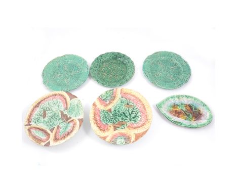 A collection of green and multi-coloured leaf moulded Majolica plates and tazzas, an Ashworth 26cm ironstone plate, ironstone
