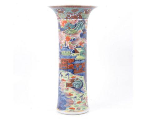 A Chinese polychrome decorated vase, flared cylindrical form, painted with gardens in a mountainous landscape, red seal mark,