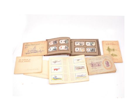 John Player &amp; Sons complete cigarette card albums, to include 'Uniforms of the Territorial Army', 'Military Uniforms of t