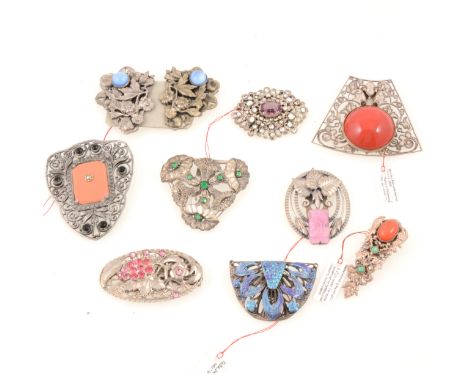 Ten vintage white metal dress clips and brooches, a French leaf design dress clip, 60mm with 30mm coral coloured cabochon to 