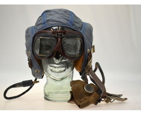A Korean War Fleet Air Arm pilot officer's blue canvas flying helmet with integral radio headphones and intercom mask to/w wi