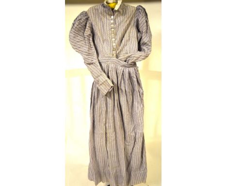 An Edwardian cotton dress, pale grey with trailing foliate pattern on white ground with mother-of-pearl button fastening to f