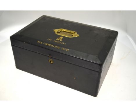 A George V leather box with lacquered brass carry handle and with gilt title 'The President War Compensation Court', beneath 