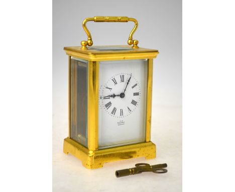 A brass carriage clock with French movement and enamel dial, from Thomas Sly of Salisbury, 11 cm Condition Report ticking, di