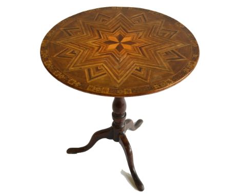 An antique Maltese tripod table, the circular top inlaid with specimen timbers, raised on a turned baluster support, 67 cm di
