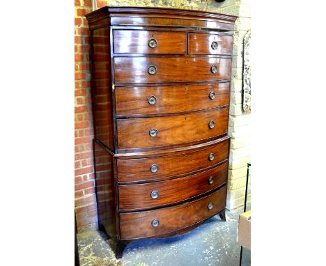 A 19th century mahogany bow front chest on chest of two short over six long graduated drawers, raised on splayed bracket feet