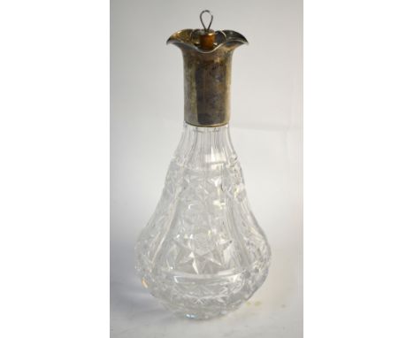 A cut glass four-division decanter, the silver collar with three quadrant stoppers (4th stopper non-matching), Frank Cobb & C