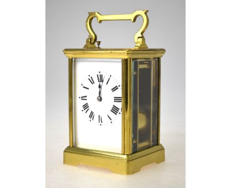 A French Grande Sonnerie repeating carriage clock with brass case, bevelled glass panels and swing handle, striking on two co