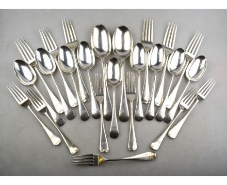 A part set of silver OEP flatware comprising nine dessert spoons, seven dessert forks, eight table forks and two table spoons