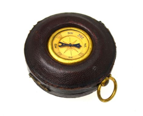 A Victorian gilt metal pocket barometer by T Wheeler, London, with silvered dial, in morocco leather outer case inset with a 