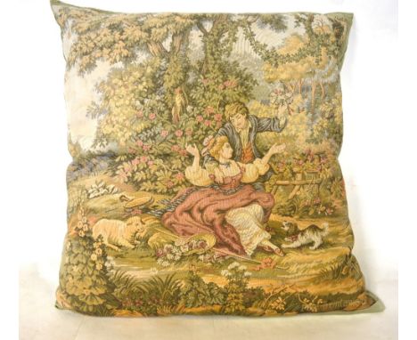A large machined tapestry covered cushion depicting courting couple and an Indian cotton beaded and mirrored throw