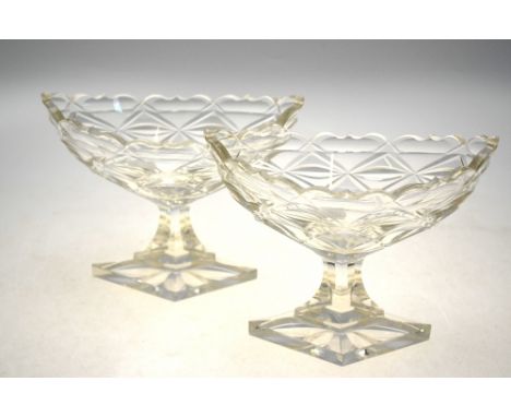 A pair of 19th century cut glass elliptical comports raised on diamond-shaped bases, 16 cm h. Condition Report Damages includ