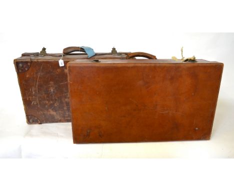 A large vintage canvas leather bound travelling trunk, to/w two large vintage tan leather suitcases (3) Condition Report Trun