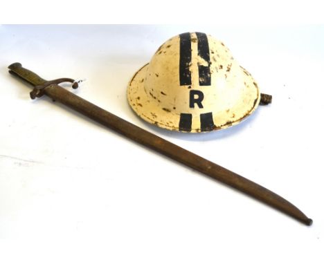 A World War II steel helmet, painted with 'R' and rank-lines, dated 1939 to/w a 19th century French bayonet with 57 cm recurv